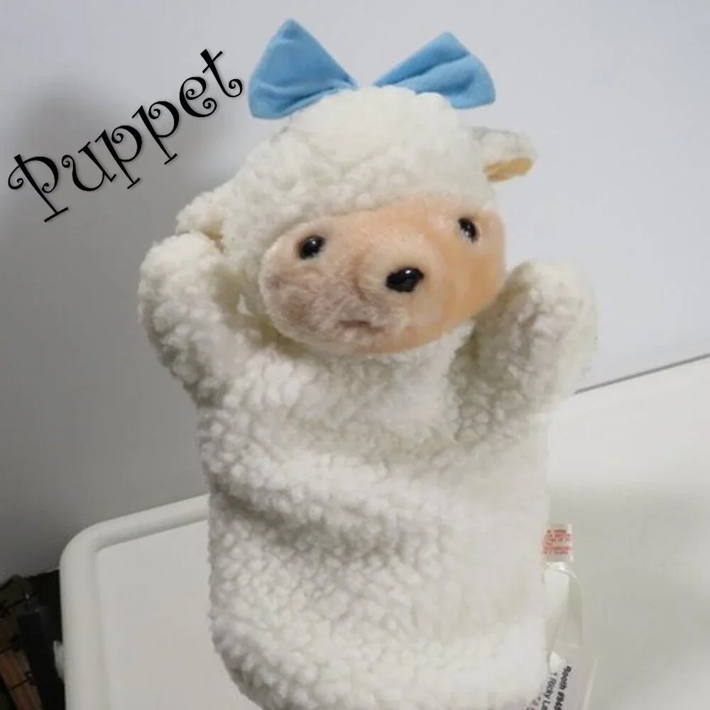 vintage sheep puppet with blue bow sewn on, lined inside thick heavy fur fabric